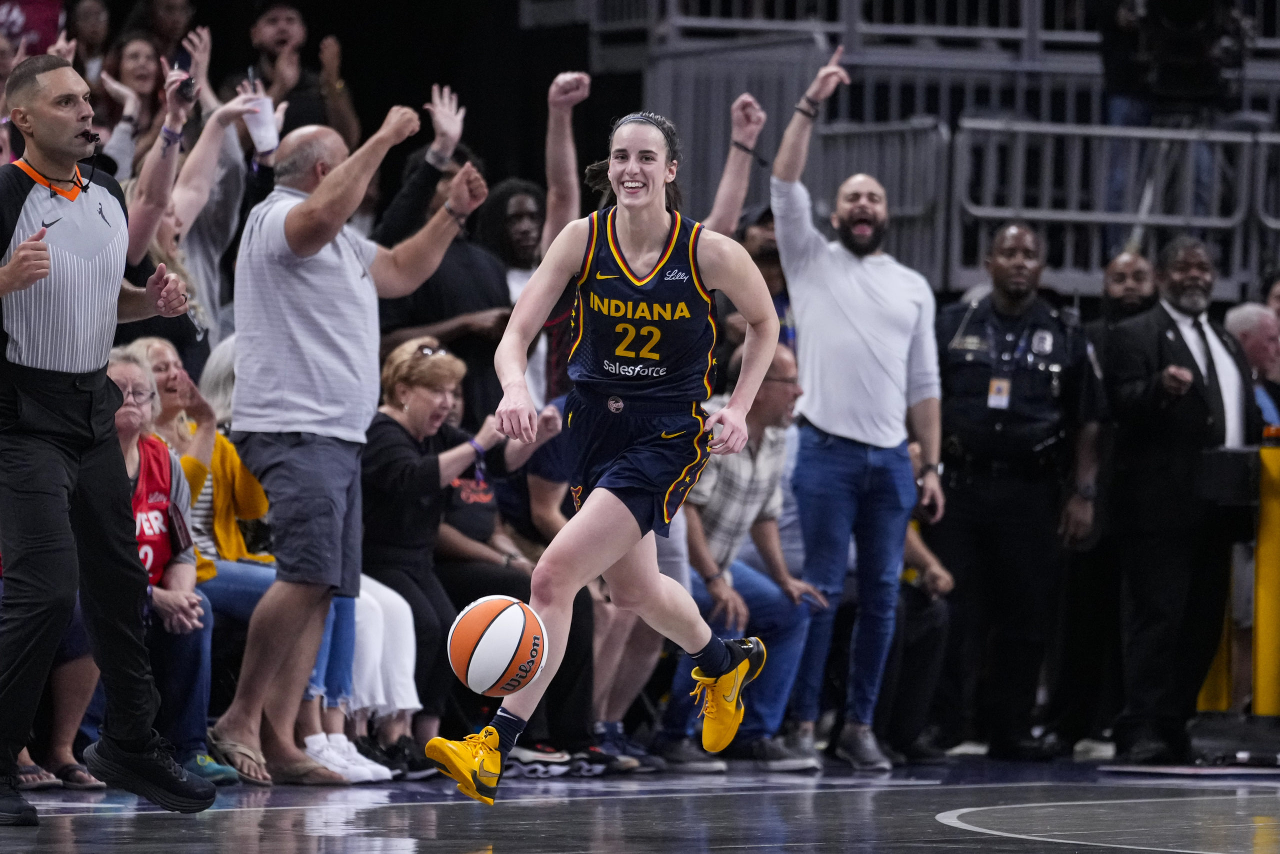 Indiana Fever guard Caitlin Clark smiles after nabbing her tenth rebound in the closing seconds of a game against the Los Angeles Sparks in Indianapolis, Indiana, on Wednesday.