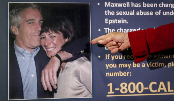 Audrey Strauss, acting U.S. attorney for the Southern District of New York, points to a photo of Jeffrey Epstein and Ghislaine Maxwell, during a news conference in New York, July 2, 2020.