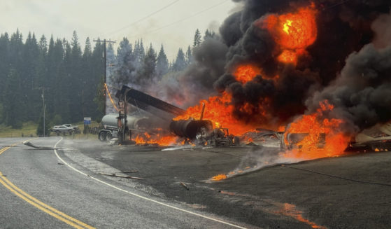 A fire burns at the gas station after an explosion in Cardiff, Idaho, on Wednesday.