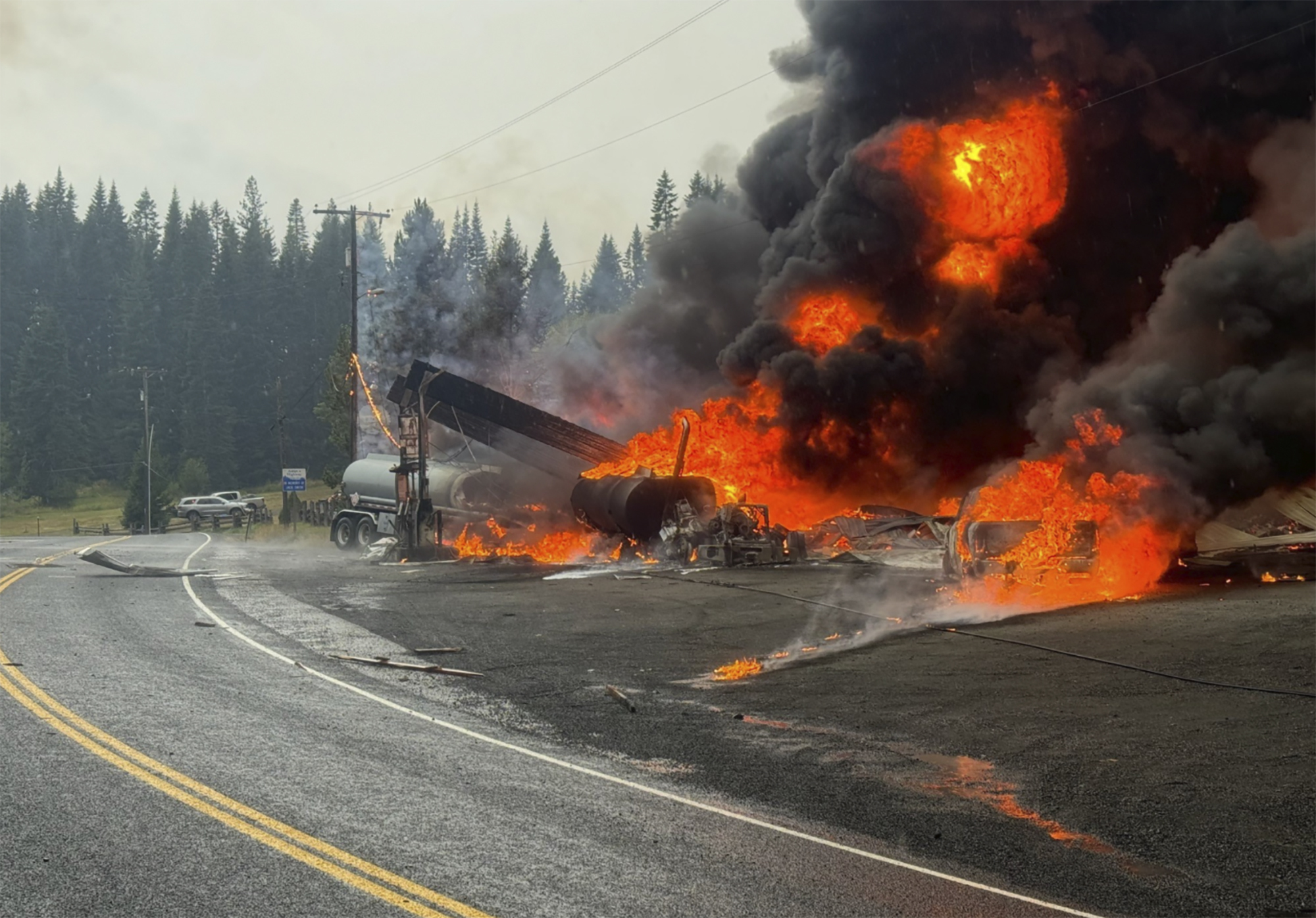 A fire burns at the gas station after an explosion in Cardiff, Idaho, on Wednesday.