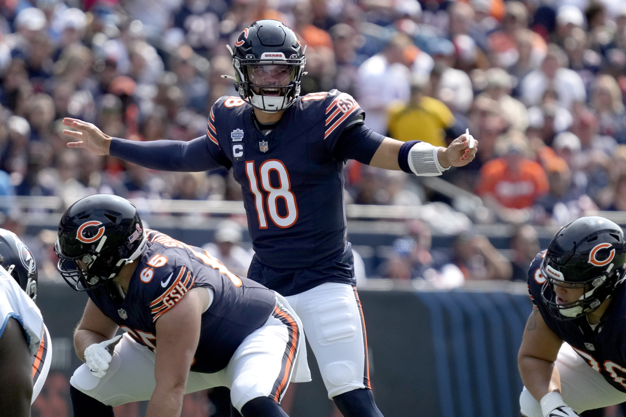 Chicago Bears quarterback Caleb Williams calls a play at the line of scrimmage during the first half of an NFL football game against the Tennessee Titans In Chicago, Illinois, on Sunday.