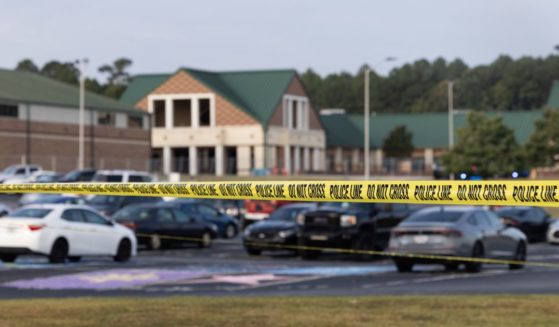 Police tape surrounds the perimeter of Apalachee High School Wednesday in Winder, Georgia, after a gunman killed two students and two teachers and wounded nine others. A 14-year-old suspect, who is a student at the school, is in custody.