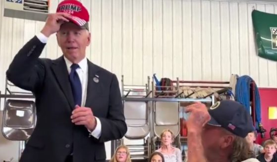 On Wednesday, President Joe Biden was seen putting on a "Trump 2024" hat while at an event.