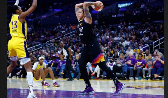 Brittney Griner #42 of the Phoenix Mercury controls the ball against the Los Angeles Sparks in the first half at Crypto.com Arena Tuesday in Los Angeles, California.