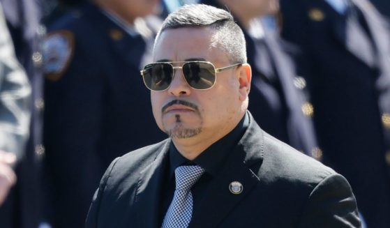 NYPD Commissioner Edward Caban, seen attending the March 30 funeral of a NYPD officer, has decided to resign one week after his home was raided by federal agents, according to news reports.