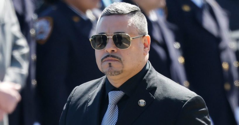 NYPD Commissioner Edward Caban, seen attending the March 30 funeral of a NYPD officer, has decided to resign one week after his home was raided by federal agents, according to news reports.