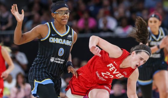 Diamond DeShields of the Chicago Sky runs into and is charged with a flagrant foul against Caitlin Clark of the Indiana Fever in Chicago, Illinois, on Friday.