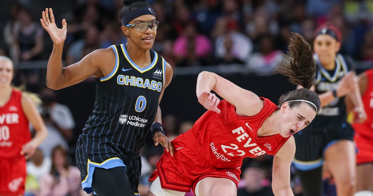 Diamond DeShields of the Chicago Sky runs into and is charged with a flagrant foul against Caitlin Clark of the Indiana Fever in Chicago, Illinois, on Friday.