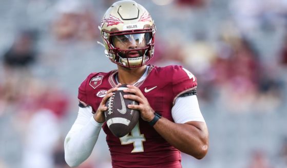 DJ Uiagalelei #4 of the Florida State Seminoles warms up before the start of a game against the Boston College Eagles in Tallahassee, Florida, o Monday.