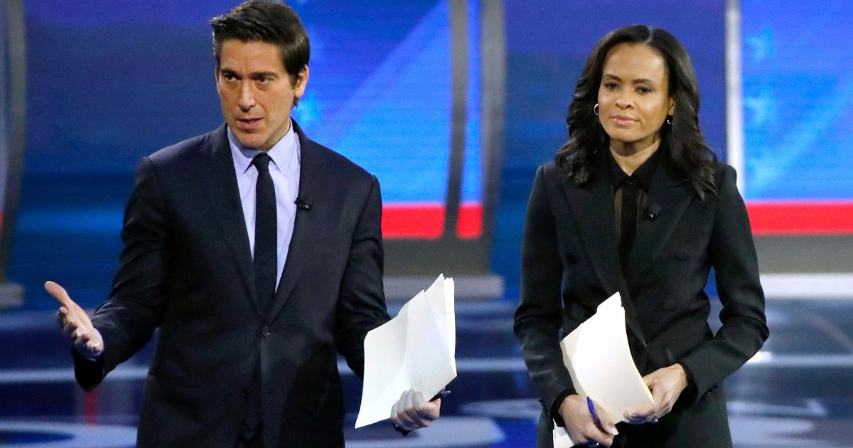 David Muir, left, and Linsey Davis, right, address members of the audience in Manchester, New Hampshire, on Feb. 7, 2020.