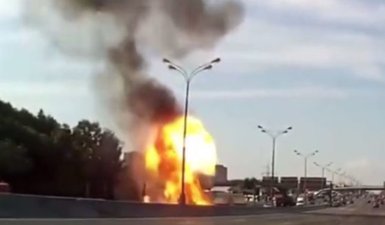 This image shows the explosion of a Tesla vehicle on a highway in 2022.