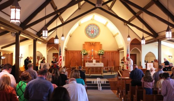 People attend a Mass at St. Phillip's Episcopal Church on May 26, 2022, in remembrance of the victims of a school shooting in Uvalde, Texas.