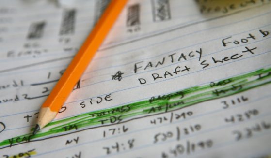 This stock image shows draft notes for a fantasy football team.