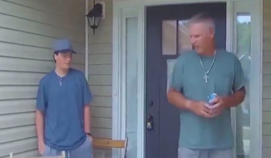 Bodycam footage released by police in Georgia, shows alleged school shooter Colt Gray, left, and his father Colin Gray, right, being questioned by police in 2023.