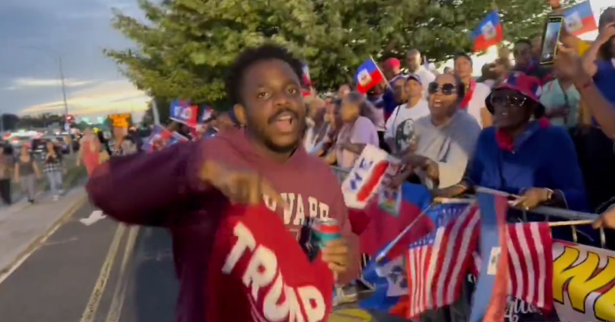 Video: Haitian Protesters Berate Black Trump Supporters Outside Rally