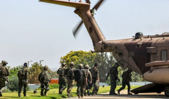 Israeli army special forces soldiers board a CH-53 Sea Stallion military helicopter before departing from the helipad of Sheba Tel-HaShomer Medical Centre in Ramat Gan on June 8.