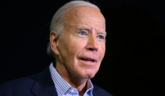 President Joe Biden speaks to reporters after landing on the South lawn of the White House in Washington, D.C., on Monday.