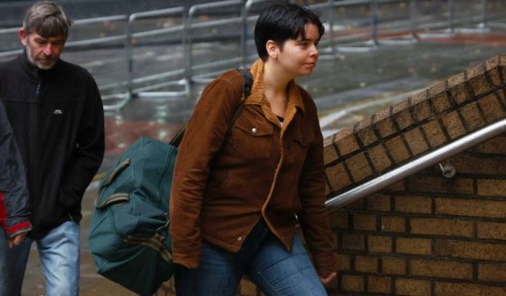 Just Stop Oil activist Anna Holland arrives at London's Southwark Crown Court Friday. Holland and another protester, Phoebe Plummer, were found guilty of criminal damage in a protest action after they splattered Vincent Van Gogh's iconic 'Sunflowers' painting with tomato soup, at the National Gallery in London in October 2022.