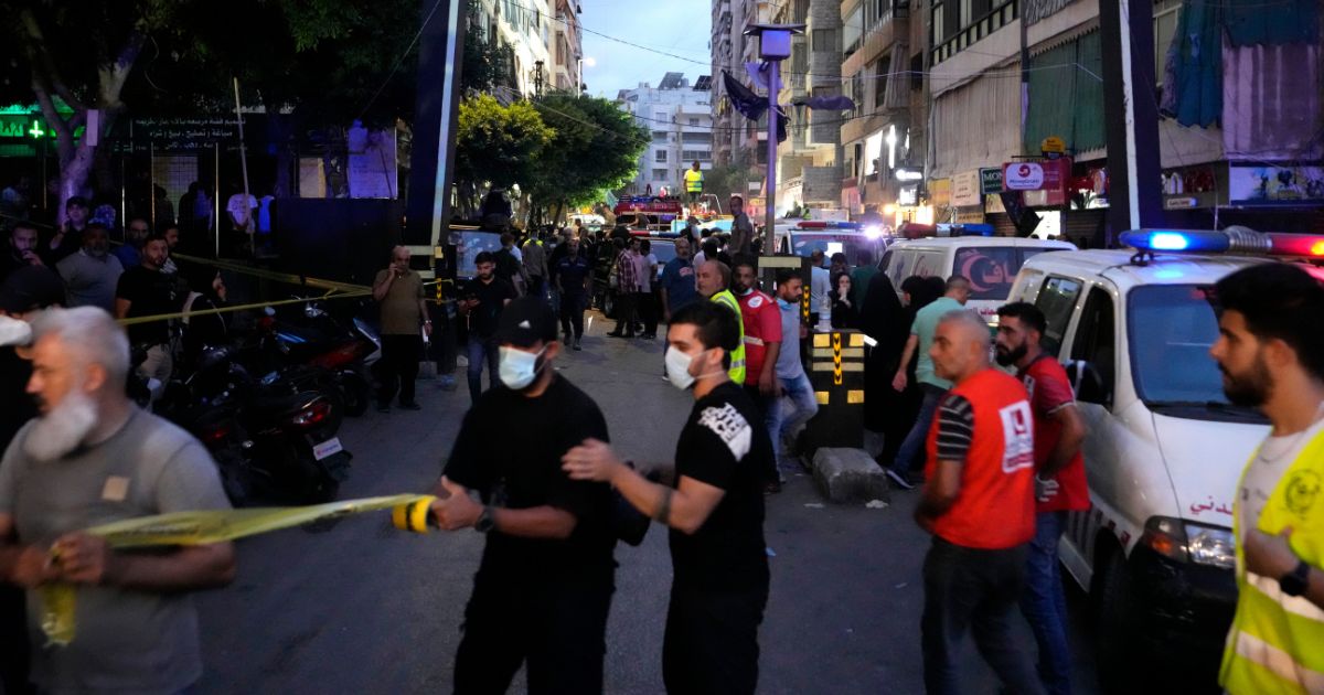 First responders work at the scene of an Israeli missile strike in Beirut, Lebanon, on Friday.