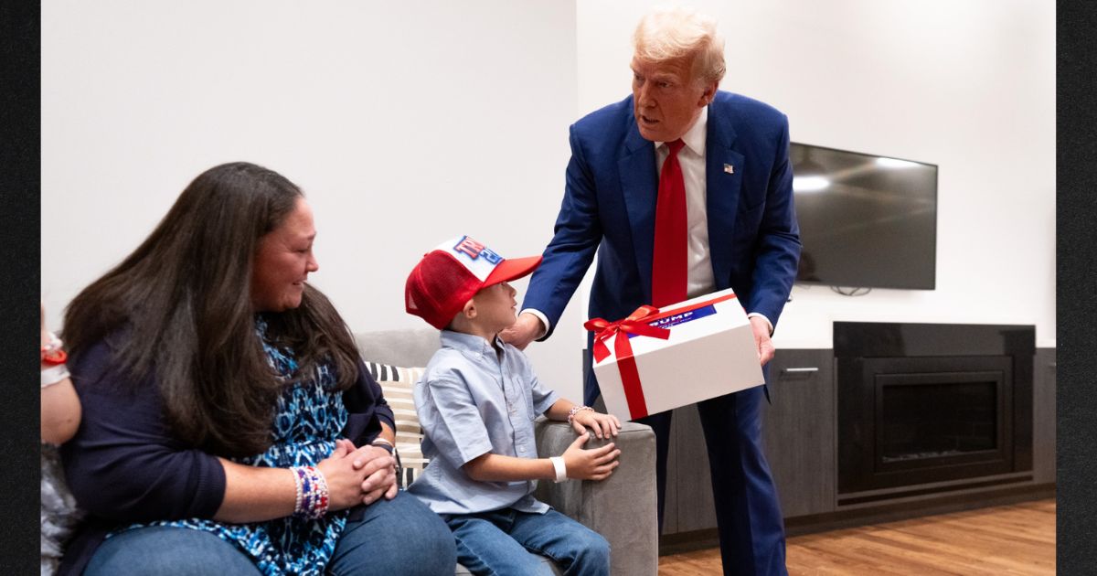 Former President Donald Trump, right, met his 8-year-old fan, Liam Licastro and his family, including Liam's mother Siobhan, left, before a campaign rally Wednesday in New York.