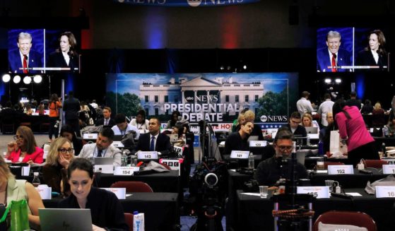 Members of the media prepare ahead of the presidential debate at the media center in Philadelphia, Pennsylvania, on Tuesday night.