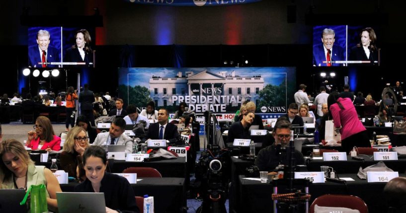 Members of the media prepare ahead of the presidential debate at the media center in Philadelphia, Pennsylvania, on Tuesday night.