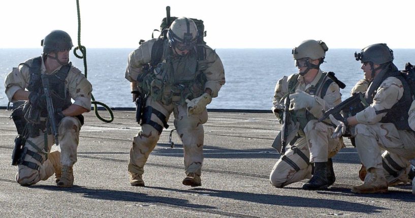 U.S. Navy SEALs complete rappelling from a helicopter to the deck of the amphibious command ship USS Mount Whitney during a training exercise on Jan. 17, 2023.