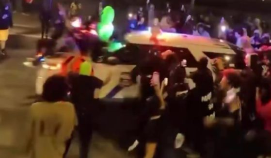 Drone footage from the weekend shows a mob of people circling a police vehicle in Philadelphia, Pennsylvania.