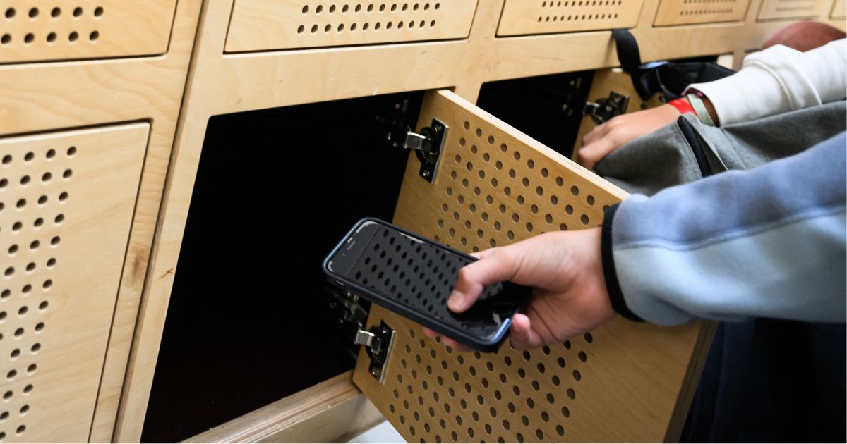 tudents put their mobile phones in their lockers after switching them off, as it is mandatory in the Auguste Brizeux highschool in Lorient, western France, on September 5, 2024.