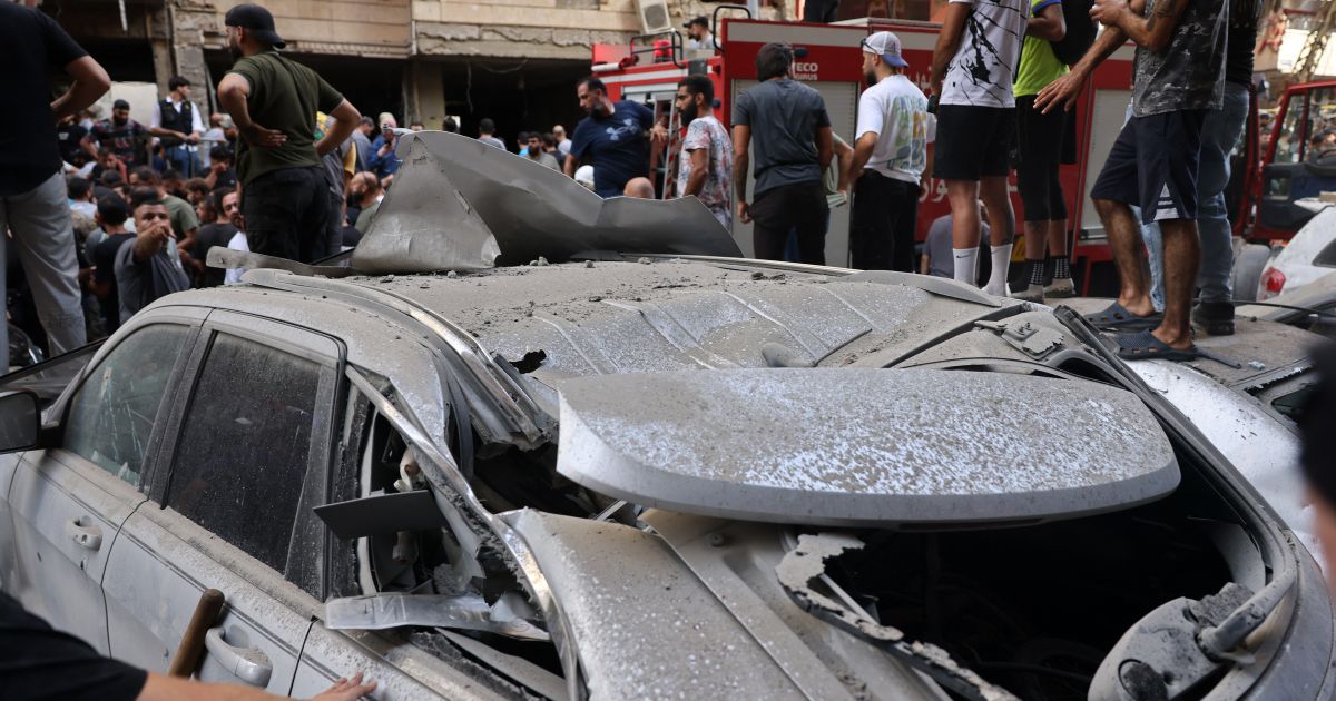 People check the damage following an Israeli strike in Beirut's southern suburbs on September 20, 2024. The Israeli military announced that the commander of Hezbollah's elite Radwan unit, Ibrahim Aqil, and other senior figures of the Lebanese armed group had been killed in the air strike.