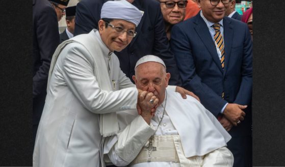 Pope Francis and Grand Imam of Istiqlal Mosque Nasaruddin Umar pose for a picture in front of the Istiqlal Mosque Thursday in Jakarta, Indonesia. Pope Francis embarked on a historic 12-day tour of Southeast Asia, which will take in Indonesia, Papua New Guinea, East Timor, and Singapore.