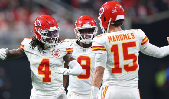 Rashee Rice, left, of the Kansas City Chiefs celebrates a touchdown with Patrick Mahomes, right, and JuJu Smith-Schuster, center, during the second quarter against the Atlanta Falcons in Atlanta, Georgia, on Sept. 22.