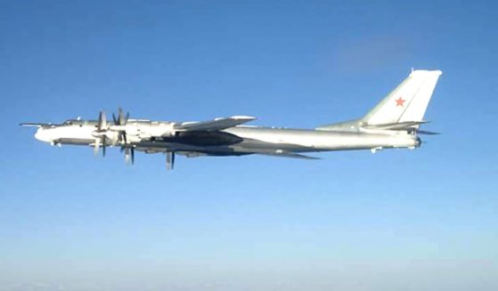 A Russian TU-95 Bear long rang bomber aircraft is shown flying near the U.S. Navy aircraft carrier USS Nimitz south of Japan on Feb. 9, 2008.