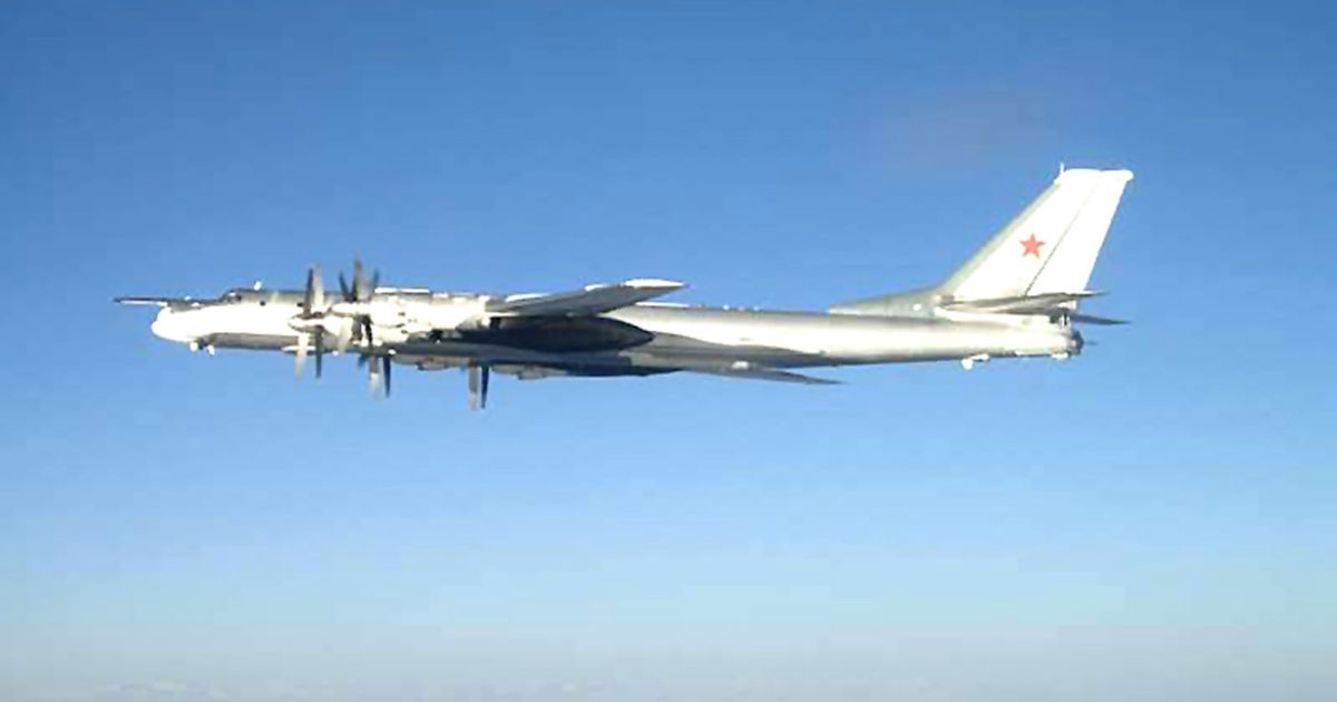 A Russian TU-95 Bear long rang bomber aircraft is shown flying near the U.S. Navy aircraft carrier USS Nimitz south of Japan on Feb. 9, 2008.