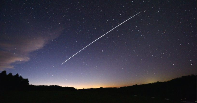 A long-exposure image shows a trail of a group of SpaceX's Starlink satellites passing over Uruguay on Feb. 7, 2021.