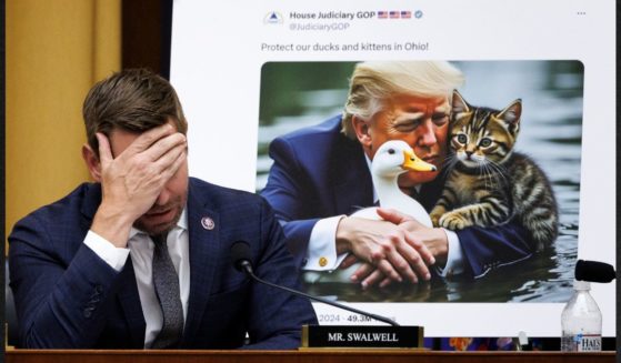 Democratic Rep. Eric Swalwell of California reacts to a committee's tweet utilizing A.I. generated imagery of Republican presidential nominee Donald Trump during a House Judiciary Committee hearing on the Southern U.S. Border on Tuesday in Washington, D.C.