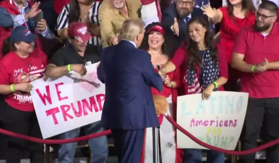 Former President Donald Trump, center, shakes hands with supporters at a campaign rally in Tucson, Arizona, on Sept. 12.