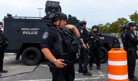 Nassau County special operations officers stand in the parking lot before Republican presidential nominee former President Donald Trump arrives to speak at a campaign event at Nassau Coliseum in Uniondale, New York, on Wednesday.