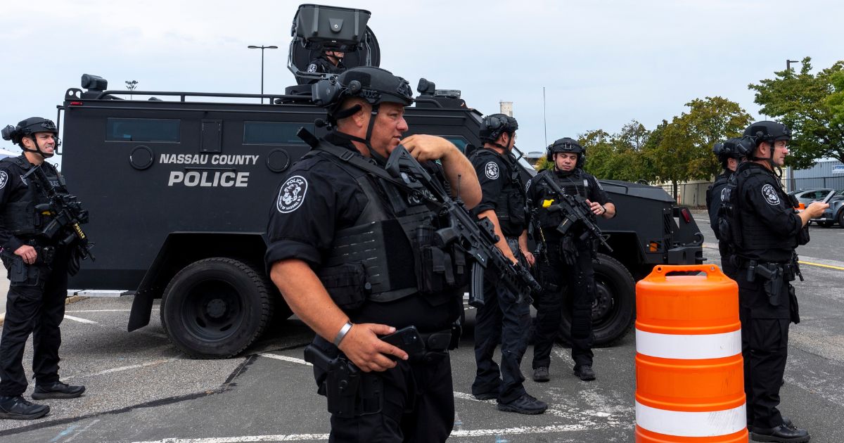 Nassau County special operations officers stand in the parking lot before Republican presidential nominee former President Donald Trump arrives to speak at a campaign event at Nassau Coliseum in Uniondale, New York, on Wednesday.