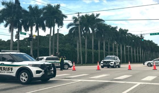 Sheriff vehicles are pictured near Trump International Golf Club in West Palm beach, Florida, after reported in the vicinity of former President Donald Trump.