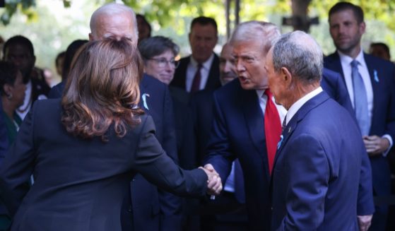 Vice President Kamala Harris, left, shakes the hand of former President Donald Trump, second from right, at a memorial service for the Sept. 11, 2001, terror attacks in New York City on Wednesday.