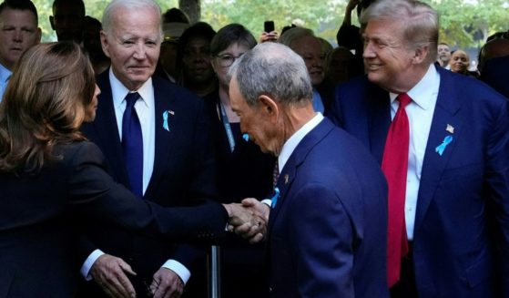 Former President Donald Trump, right, shakes hands with Vice President Kamala Harris, left, during a remembrance ceremony on the 23rd anniversary of the September 11 terror attack on the World Trade Center at Ground Zero, in New York City on Wednesday.