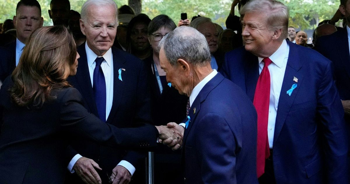 Former President Donald Trump, right, shakes hands with Vice President Kamala Harris, left, during a remembrance ceremony on the 23rd anniversary of the September 11 terror attack on the World Trade Center at Ground Zero, in New York City on Wednesday.