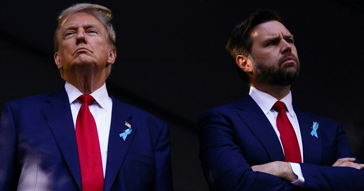 Former President Donald Trump, left, and Sen. J.D. Vance, right, his running mate, attend a remembrance ceremony on the 23rd anniversary of the September 11 terror attack on the World Trade Center at Ground Zero in New York City on Sept. 11.