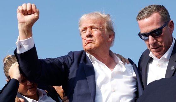 Former President Donald Trump is rushed offstage by U.S. Secret Service agents after being grazed by a bullet during a rally on July 13, 2024 in Butler, Pennsylvania. Trump has announced he is returning to Butler in October for another rally.