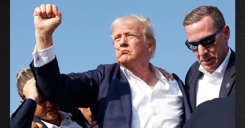 Former President Donald Trump is rushed offstage by U.S. Secret Service agents after being grazed by a bullet during a rally on July 13, 2024 in Butler, Pennsylvania. Trump has announced he is returning to Butler in October for another rally.