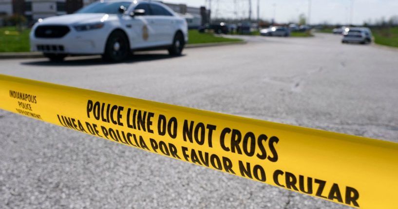 Police caution tape blocks the entrance to the site of a mass shooting at a FedEx facility in Indianapolis, Indiana on Friday, April 16, 2021. - A gunman has killed at least eight people at the facility before turning the gun on himself in the latest in a string of mass shootings in the country, authorities said. The incident came a week after President Joe Biden branded US gun violence an "epidemic" and an "international embarrassment" as he waded into the tense debate over gun control, a powerful political issue in the US.