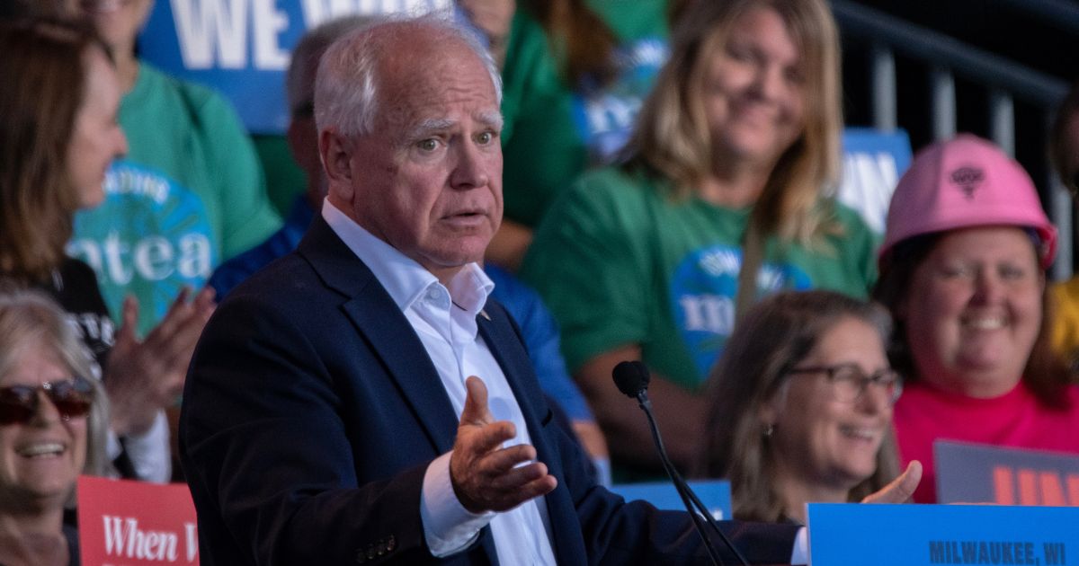 Democratic vice presidential nominee Minnesota Gov. Tim Walz, seen at a Monday campaign event, has been shielded from reporters, much like his running mate Vice President Kamala Harris.