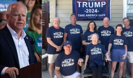 Family members, right, of Minnesota Gov. and Democratic vice presidential candidate Tim Walz, left, take a picture showing their support for Republican presidential candidate and former President Donald Trump.