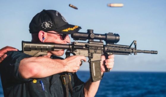 Navy Cmdr. Cameron Yaste was relieved of duty on Friday, after appearing in this photo on an official Navy Instagram account in April, which drew heavy criticism.